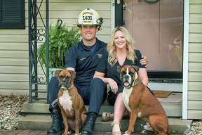 Ahlemeyer and his girlfriend, Kristen Schmidt, and their dogs in a recent family photo.