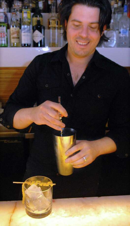 116 Crown Street owner John Ginnetti, shown in a file photo, will host a Garden Cocktail Party May 22. Photo: /