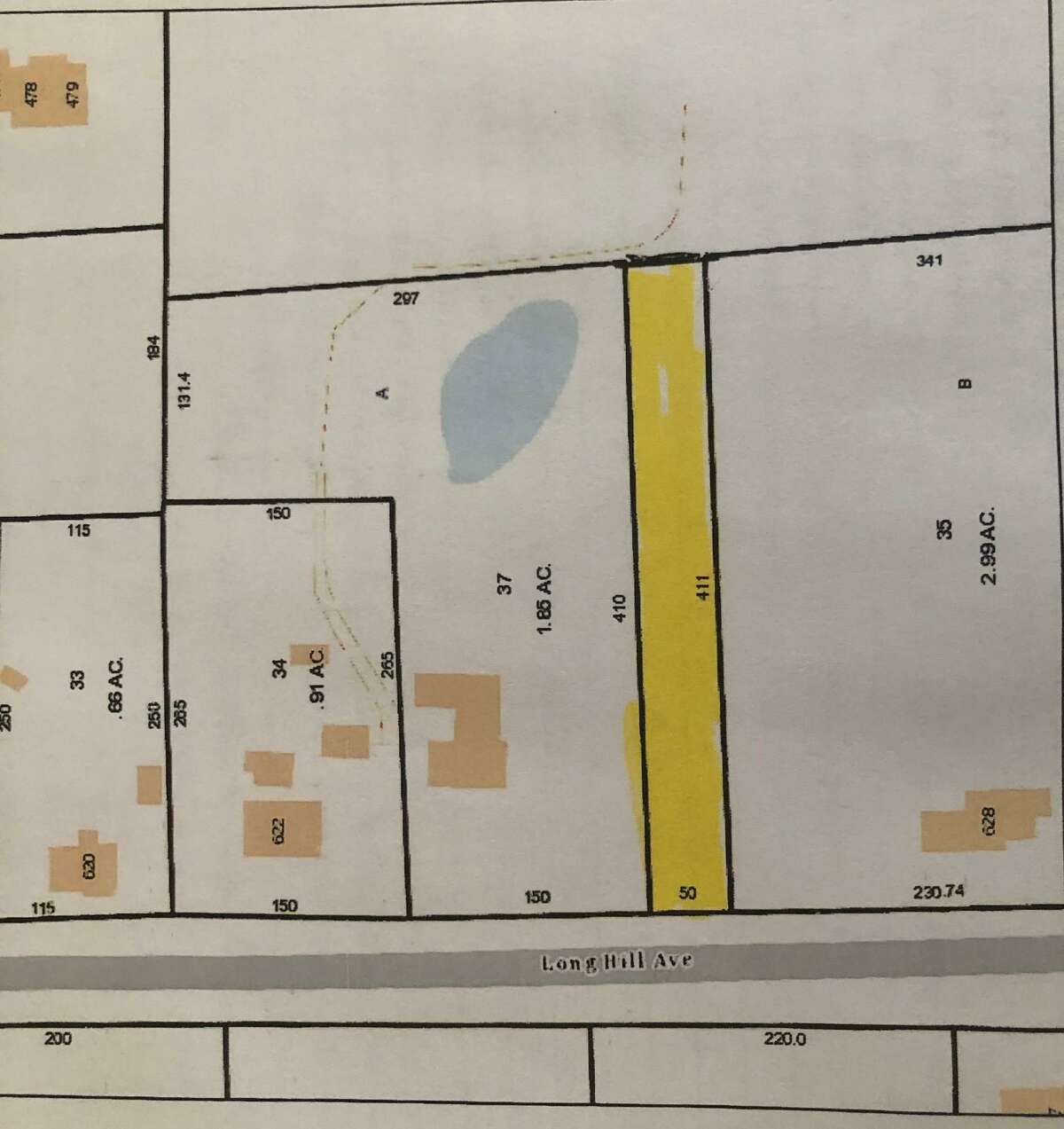 The 0 Long Hill Avenue parcel is described as a rectangular strip of land, 50 feet wide, 411 feet in length, and located in a R-1 residential zone. The parcel the city hopes to sell is shaded.