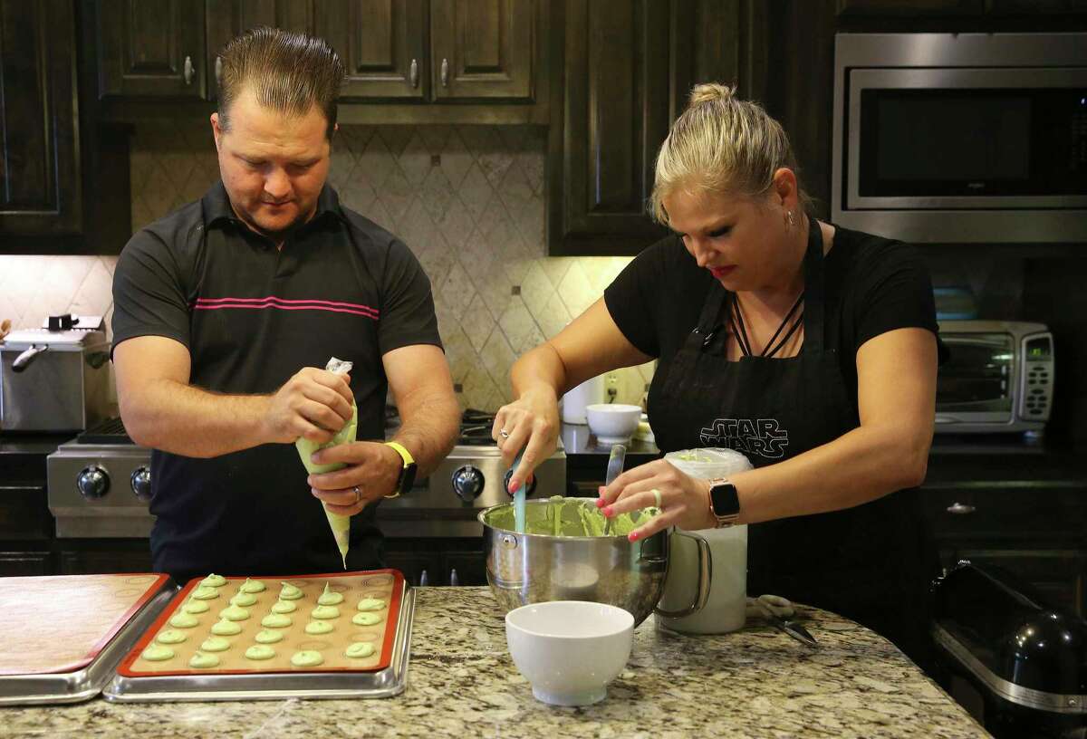 Beth Erwin and her husband, Miles, prepare to bake macarons at their home during the COVID-19 outbreak.