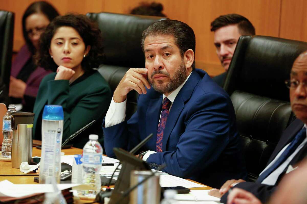 Harris County Precinct 2 Commissioner Adrian Garcia, right, and County Judge Lina Hidalgo, shown here during a Commissioners Court meeting in Houston in March 2020, joined their three colleagues in unanimously approving a $3.3 billion general fund budget Tuesday.