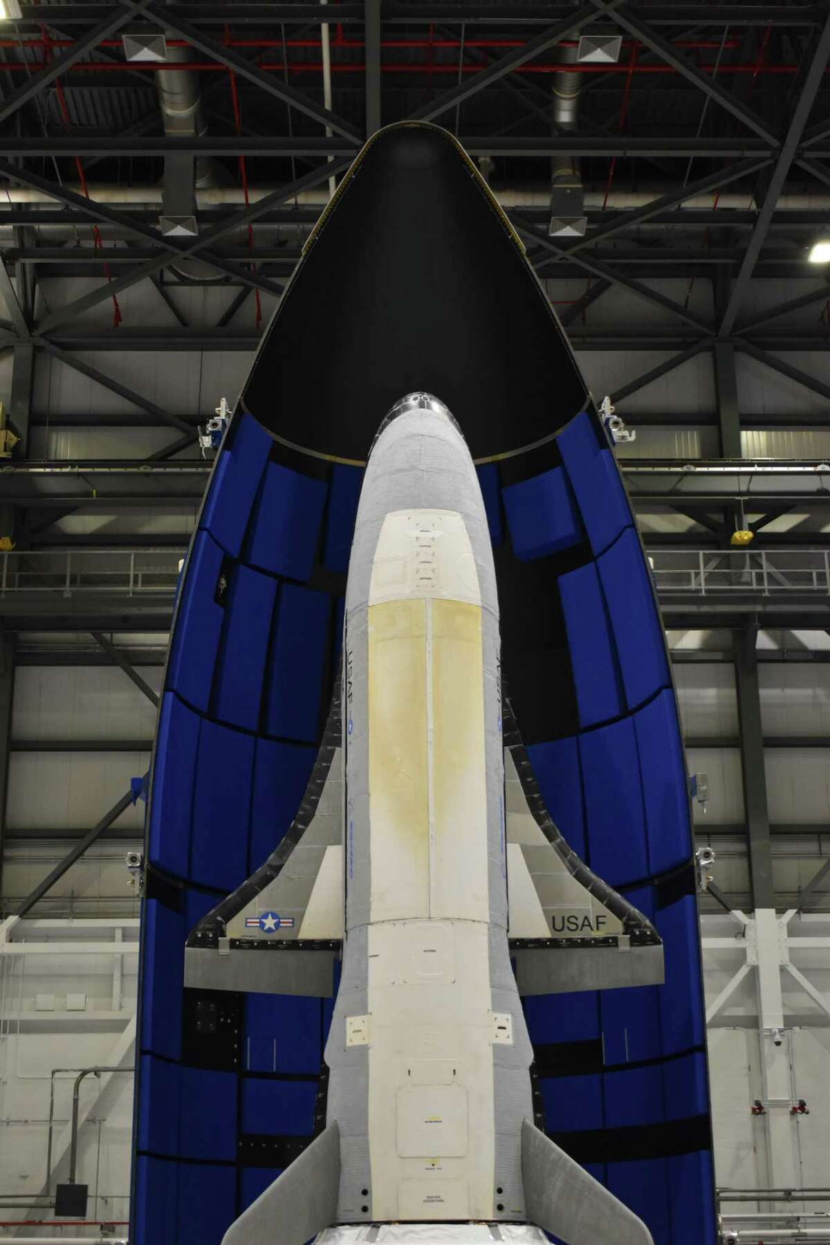 The encapsulated X-37B Orbital Test Vehicle for United States Space Force-7 mission. The vehicle is covered by a fairing during launch.