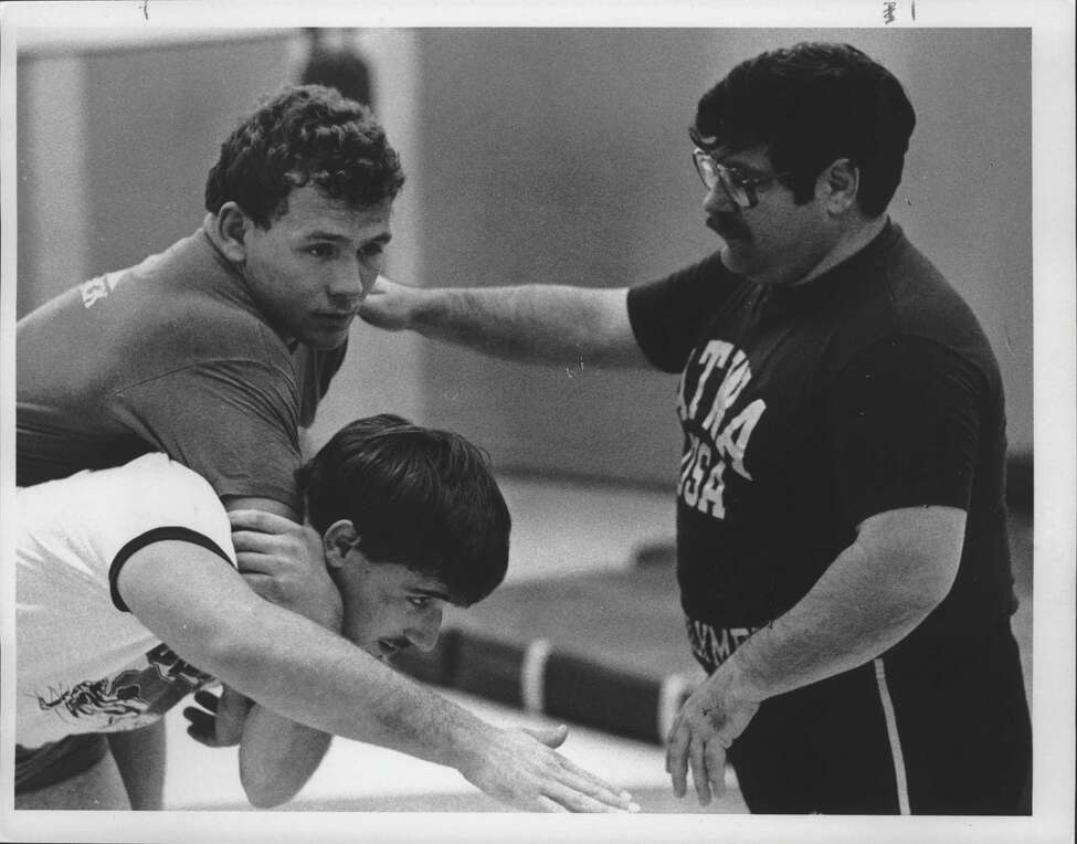 Wrestlers practice at State University of New York, Albany - Chris Tironi Undated (dark shirt), Matthew Ryan, and Joe DeMeo. September 26, Undated (Hai Do/Times Union Archive)