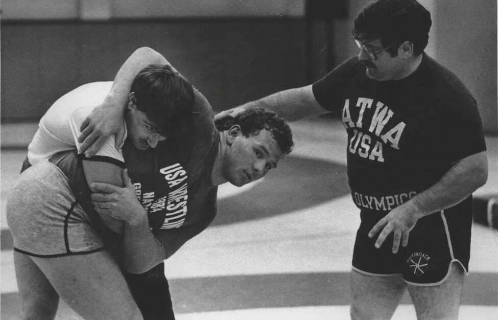 Wrestlers practice at State University of New York, Albany - Chris Tironi Undated (dark shirt), Matthew Ryan, and Joe DeMeo. September 26, Undated (Hai Do/Times Union Archive)