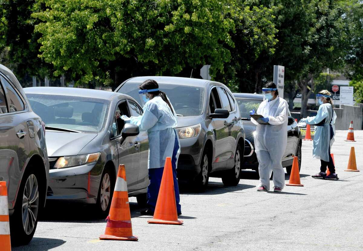 Ridgefield will be offering nose swab COVID-19 testing at the Recreation Center off Danbury Road on Saturday, May 16 from 11 to 2:30. People are asked to pre-register. Here workers in personal protective equipment performed drive-up testing at the Westfield Fashion Square on May 13, in Los Angeles, California. A nasopharyngeal swab test kit was utilized at this COVID-19 testing center to determine the viral load and virus count of a patient. Photo by Kevin Winter/ Getty Images