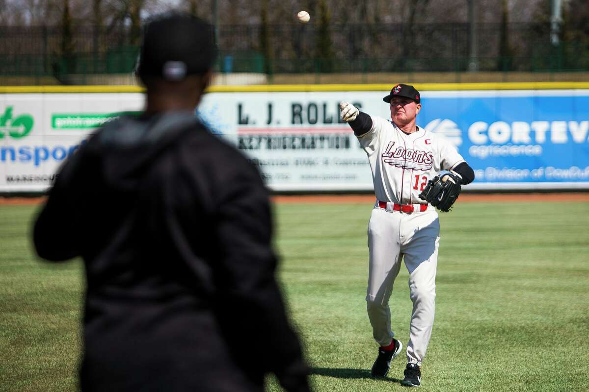 Great Lakes Loons manager John Shoemaker warms up during practice in April 2019 at Dow Diamond. (Katy Kildee/kkildee@mdn.net)