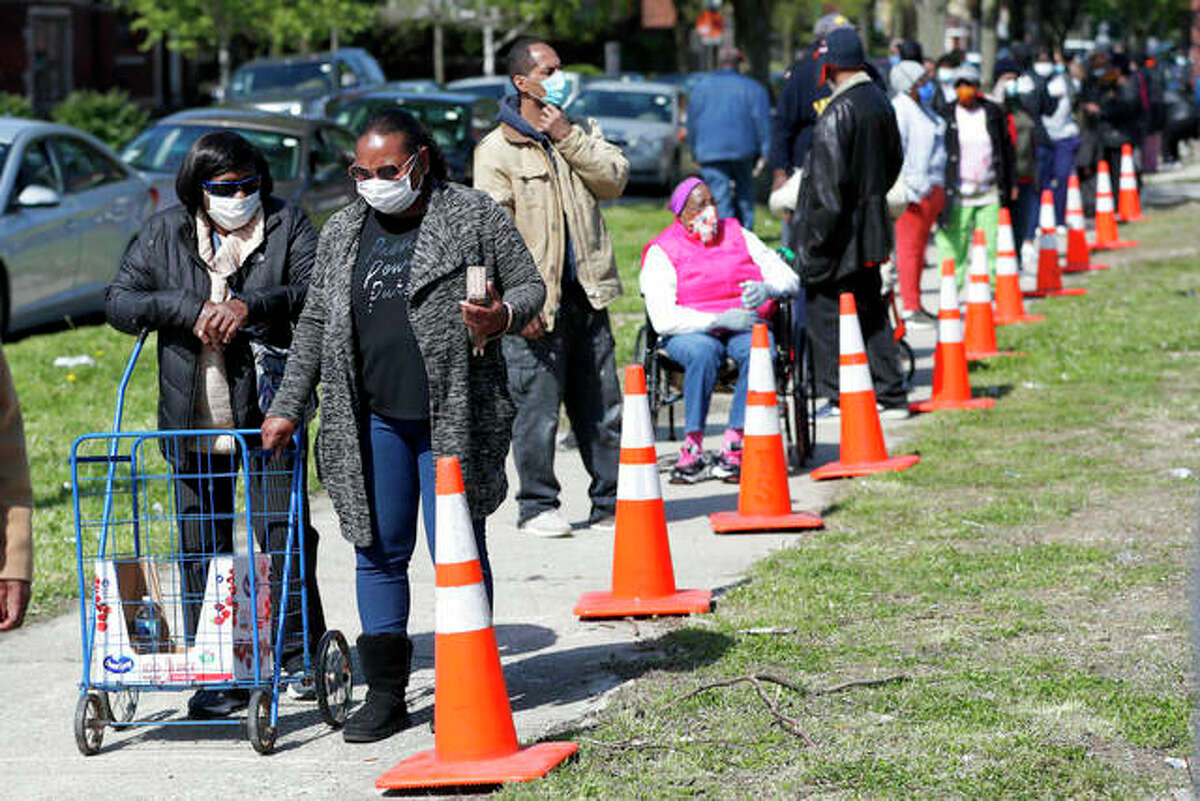 People from all walks of life line up for a food giveaway sponsored by the Greater Chicago Food Depository in the Auburn Gresham neighborhood of Chicago. Across the country, food insecurity is adding to the anxiety of millions of people, according to a new survey that finds 37% of unemployed Americans ran out of food in the past month, while 46% worried that they would.