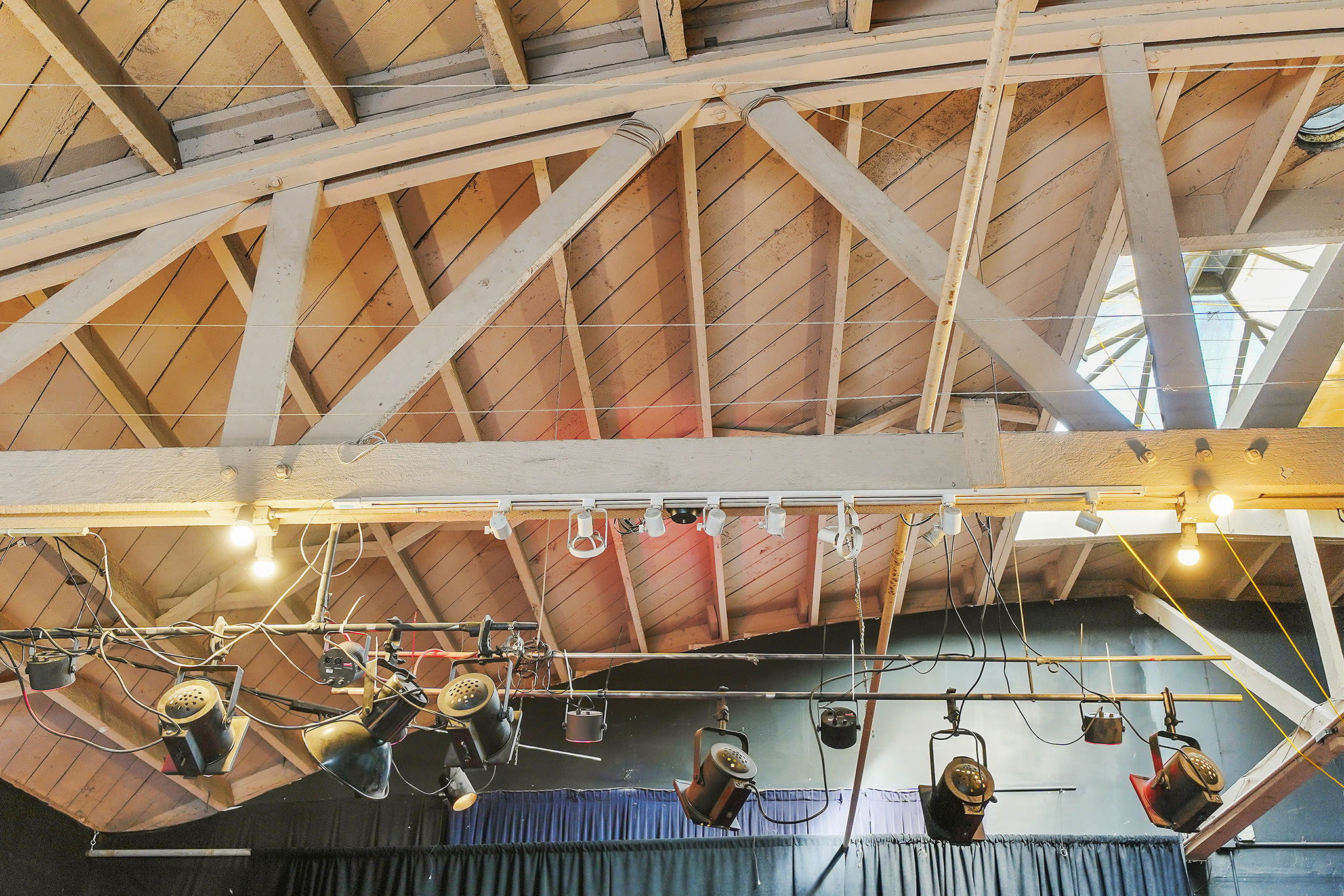 The soaring wood frame bowed truss ceiling.