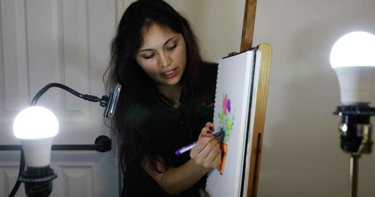 Hannah Garrison livestreams an art lesson from her bedroom studio.