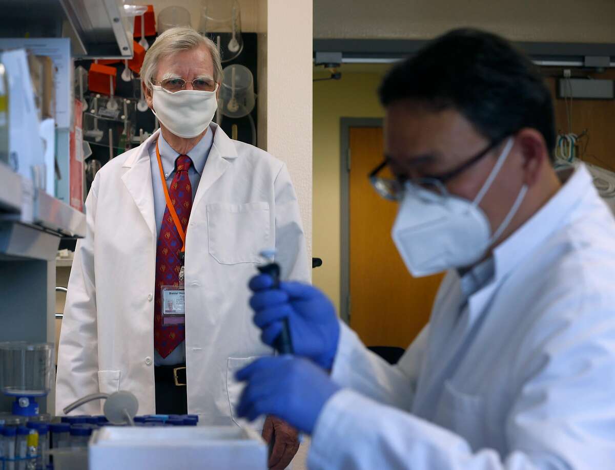 Verndari CEO Dr. Daniel Henderson (left) is leading the development of a coronavirus vaccine patch at the company's biotech lab in Sacramento, Calif. on Thursday, May 7, 2020. At right, Taeho Kim works on the vaccine. Verndari is racing to develop a COVID-19 vaccine administered through a patch worn on the skin.