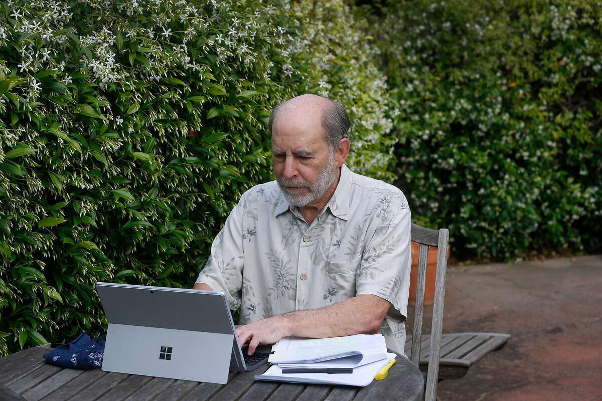 Attorney Michael Rubin works in the front patio of his home in Berkeley, Calif. on Wednesday, May 13, 2020.