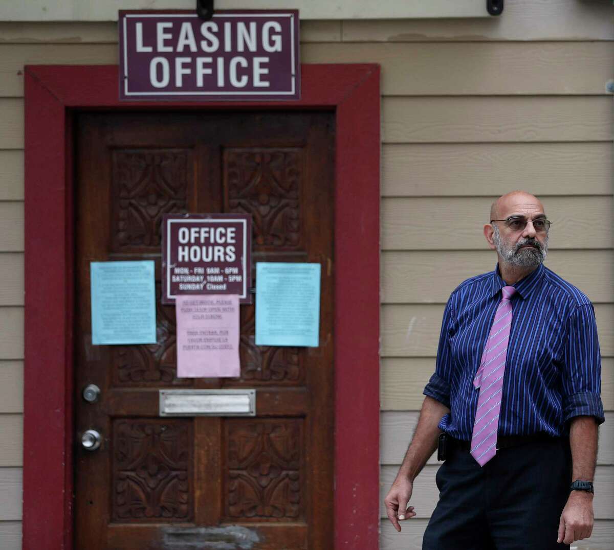 Landlord Jack Yetiv stands outside of the leasing office at the Westview Forest apartment complex in Houston, Monday, March 30, 2020.