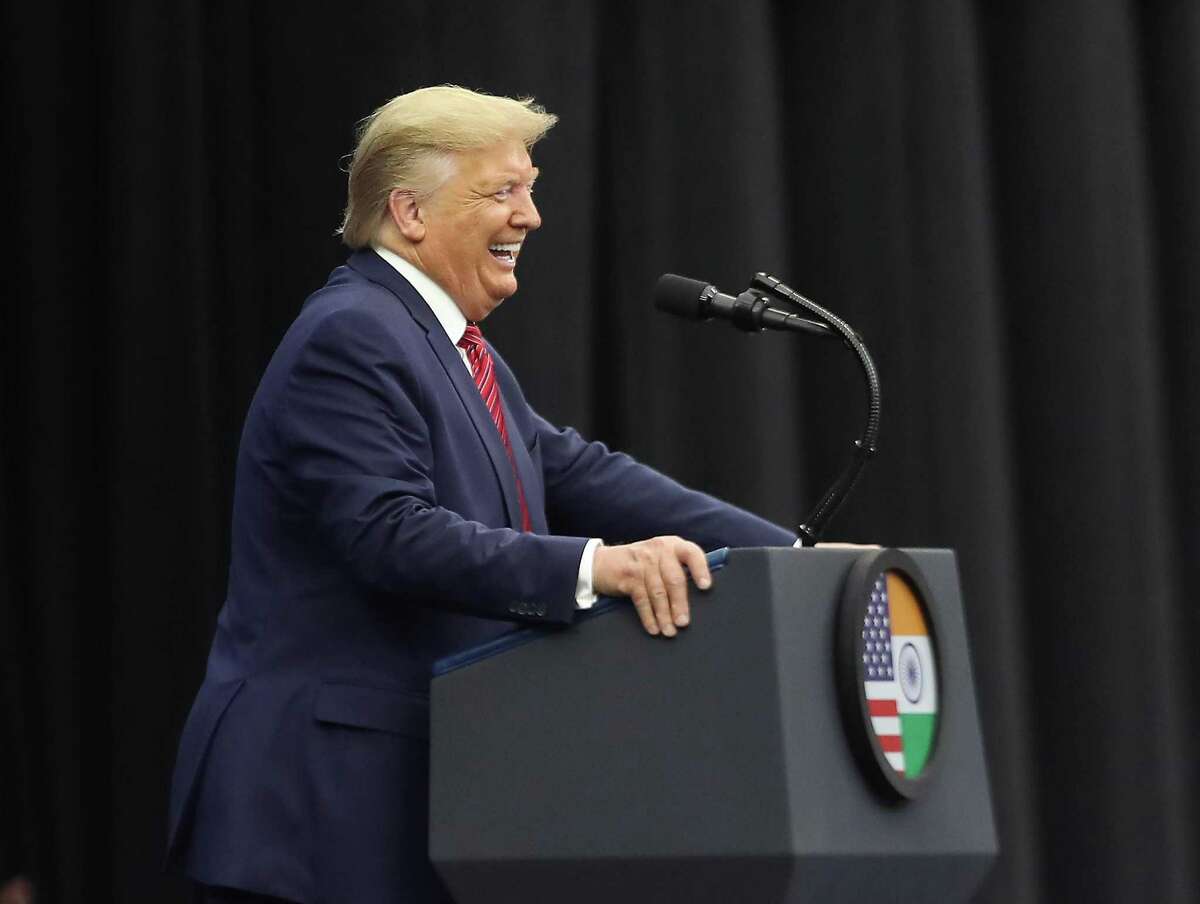 President Donald Trump laughs as he talks during a Howdy Modi event for India's prime minister, Narendra Modi at NRG Stadium Sunday, Sept. 22, 2019, in Houston.