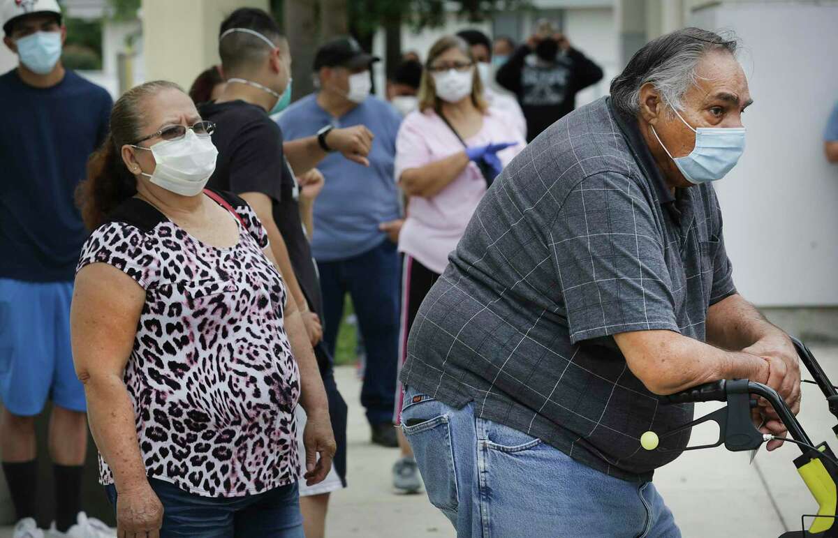 People line up for COVID-19 testing at Las Palmas Public Library, on Thursday, May 7, 2020.