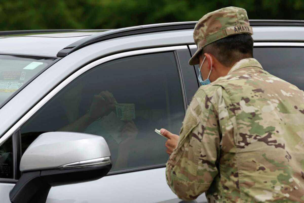 A person checks in to a COVID-19 testing site located on Eisenhauer Road on May 15, one of several manned by members of the Texas National Guard.