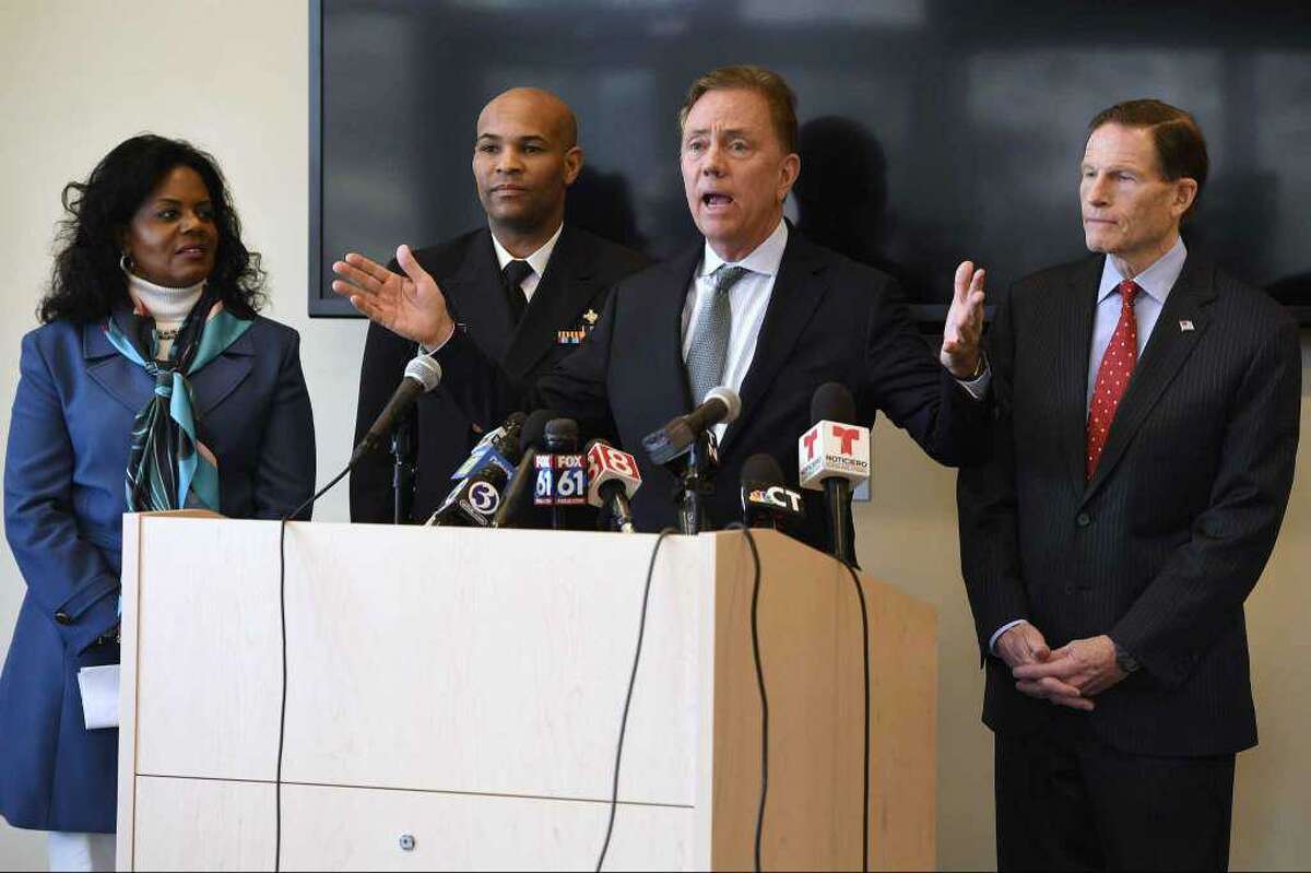 In March, as the coronavirus pandemic was getting a toehold in the state, Gov. Ned Lamont, center, spoke to reporters as Public Health Commissioner Renée D. Coleman-Mitchell, left, U.S. Surgeon General Vice Admiral Jerome M. Adams, second from left, and U.S. Sen. Richard Blumenthal, D-Conn., right, listened, at the Connecticut State Public Health Laboratory in Rocky Hill. Lamont announced Tuesday that he fired Coleman-Mitchell about a year after she was appointed to the job.
