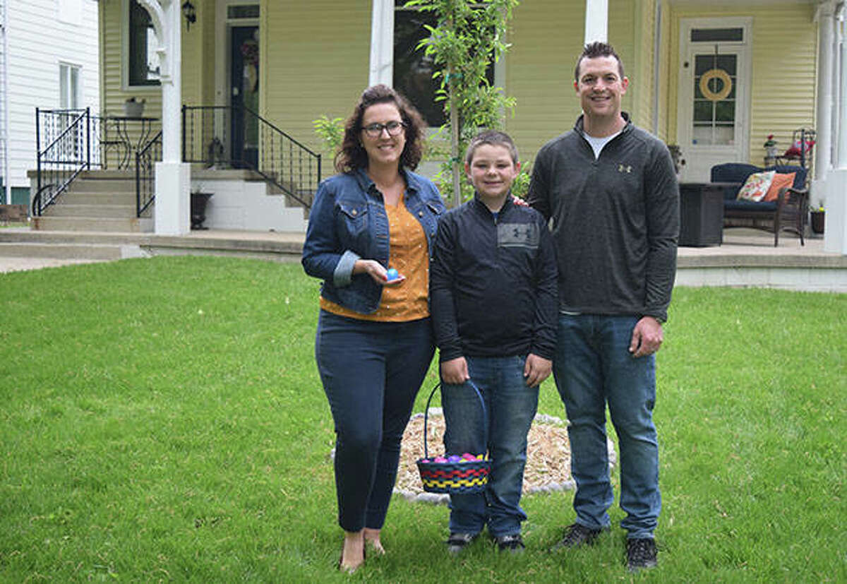 Cori (from left), Brayden and Brian Tobin loaned the use of their front porch for an Easter egg hunt. Cori and Brayden, 10, filled eggs with candy and invited anyone to visit and take an egg.