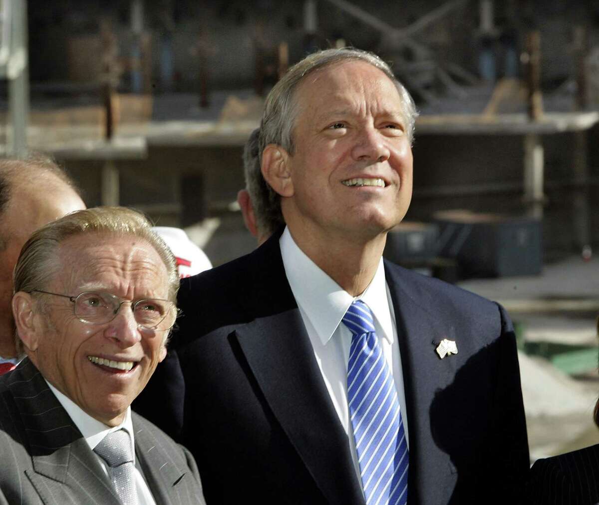 New York Governor George Pataki, right, and developer Larry Silverstein smile as the first piece of heavy equipment heads down the ramp into the World Trade Center site April 27, 2006, in New York. The event marks the beginning of construction of the Freedom Tower, the symbolic skyscraper designed to replace the destroyed World Trade Center.