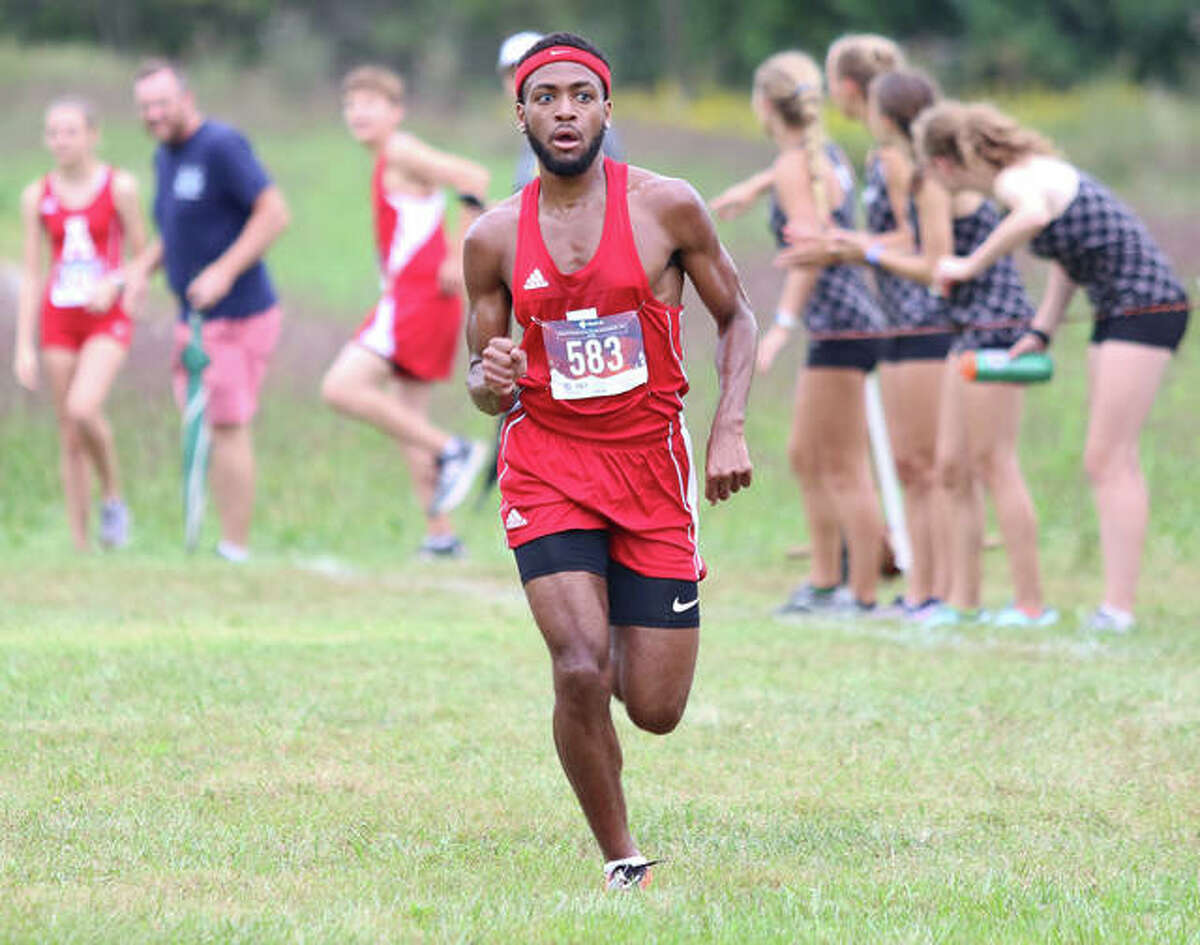 Alton senior Cassius Havis runs alone in second place at the Edwardsville Invite, while eyeing the finish line in a 5K cross country race at SIUE on Sept. 19. Havis was denied his shot at Redbirds track history when the 2020 season was cancelled.
