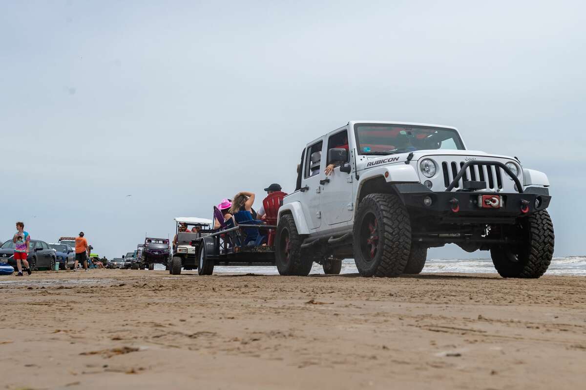 Hundreds hit the beach for 'Go Topless' weekend despite virus, weather