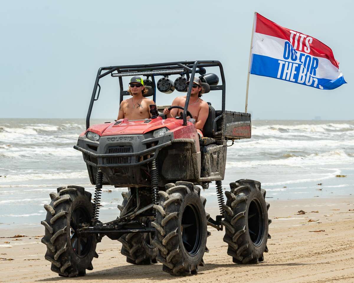 Hundreds hit the beach for 'Go Topless' weekend despite virus, weather
