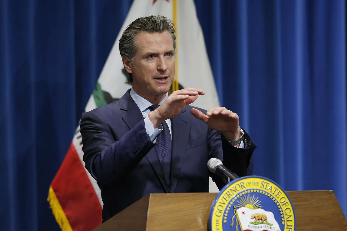 FILE - In this May 14, 2020, file photo, California Gov. Gavin Newsom discusses his revised 2020-2021 state budget during a news conference in Sacramento, Calif. Newsom's proposed budget cuts include canceling billions of dollars in climate change spending, a blow to environmental advocates who look to the state as a stopgap for the Trump administration's weakening of federal protections. (AP Photo/Rich Pedroncelli, Pool, File)