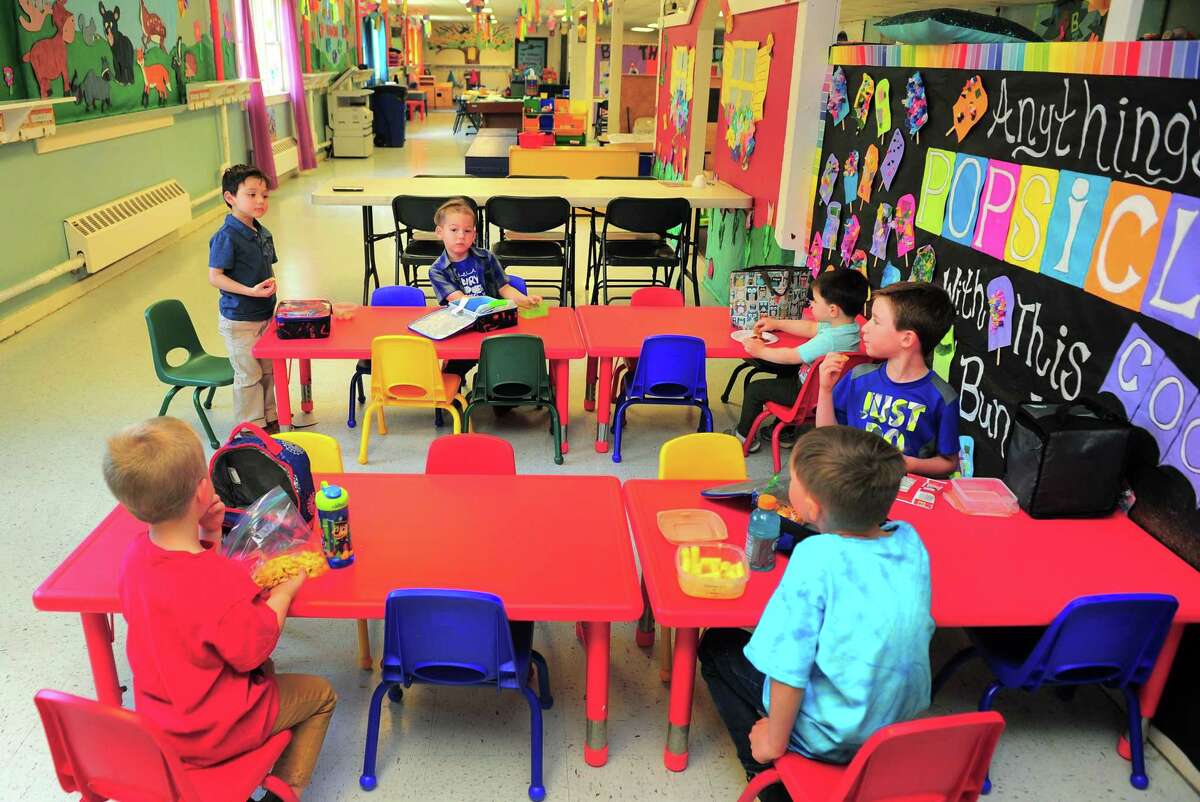 Children have their lunch at The Hideout, a preschool and child care facility in Shelton.