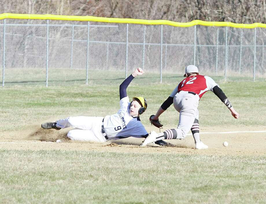 Manistee senior Andrew Jackoviak slides safely into third last season. (News Advocate file photo)