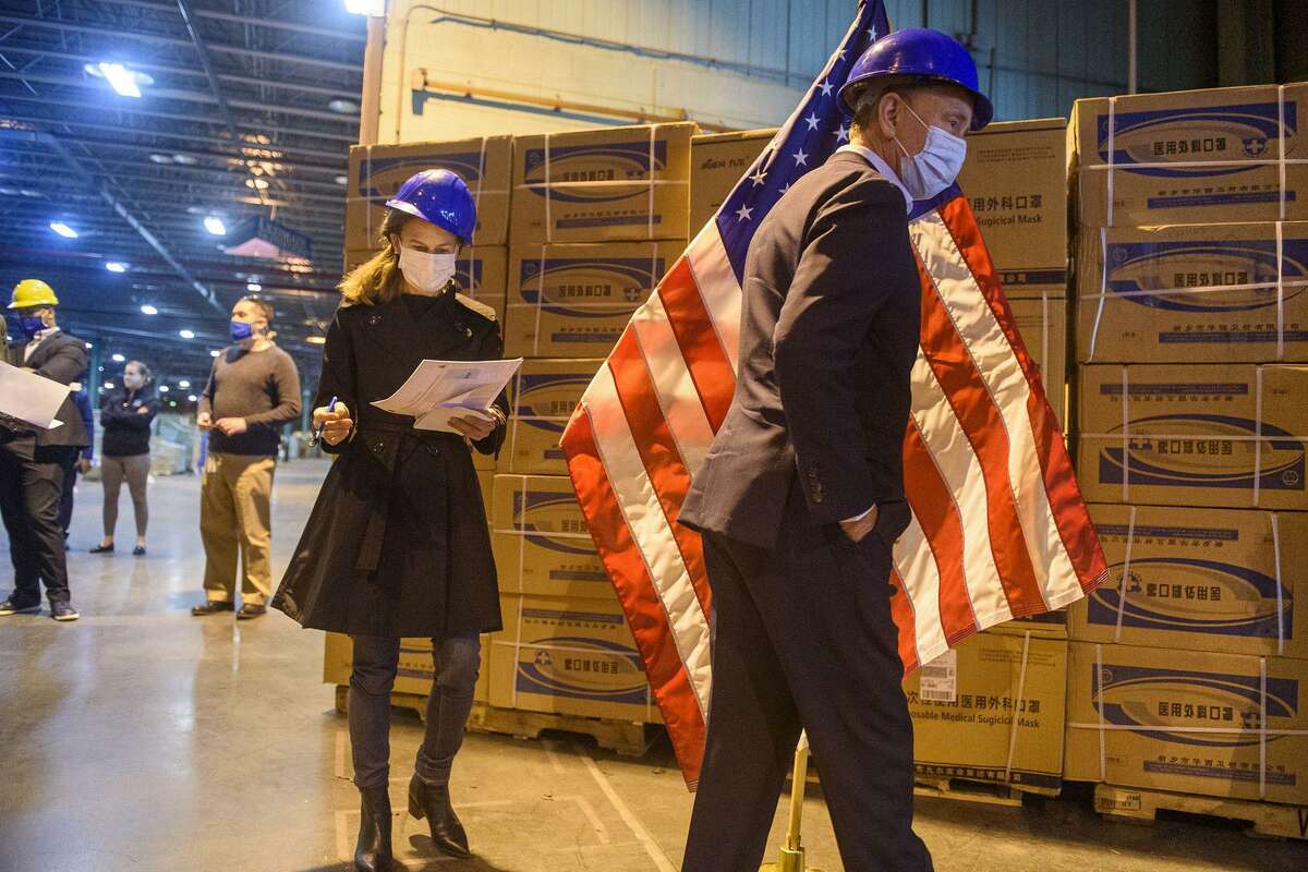 Gov. Ned Lamont and Lt. Gov. Susan Bysiewicz tour the State of Connecticut's commodities warehouse soon after receiving six million surgical masks, 500,000 protective masks, 100,000 surgical gowns and 100,000 thermometers -- nearly $15 million in all -- from China. (Mark Mirko/Hartford Courant/TNS)