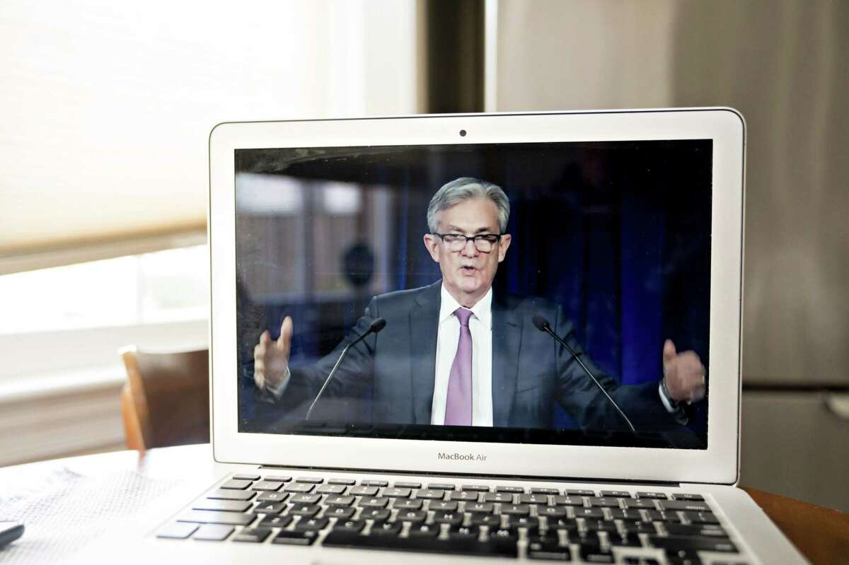 Jerome Powell, chairman of the U.S. Federal Reserve, speaks during a virtual news conference seen on a laptop computer in Arlington, Va., on April 29, 2020.