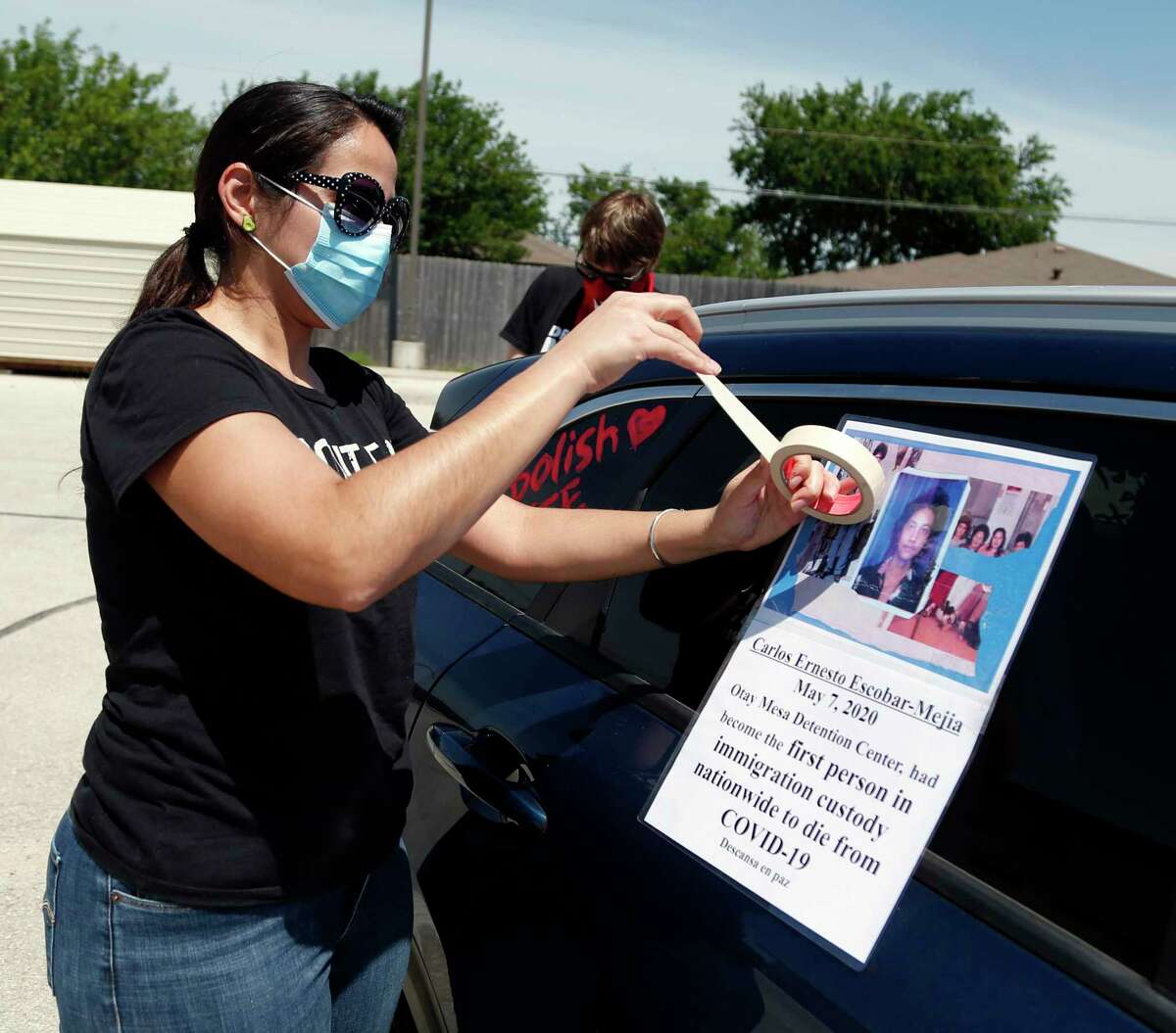 Rachael Tucker prepares her vehicle for the advocacy group car protest near the Karnes County Residential Center 409 FM1144, Karnes City, Texas, 78118. Advocacy groups are protesting family detention amid the pandemic, as coronavirus spreads rapidly through detention facilities across the country on Saturday, May 16, 2020.