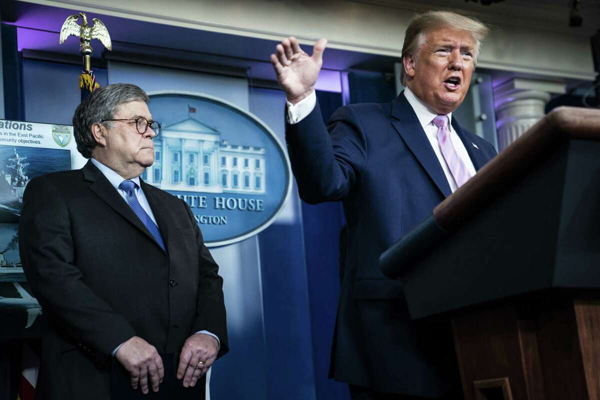 Attorney General William Barr listens as President Donald Trump speaks with members of the coronavirus task force during a briefing at the White House on April 1.