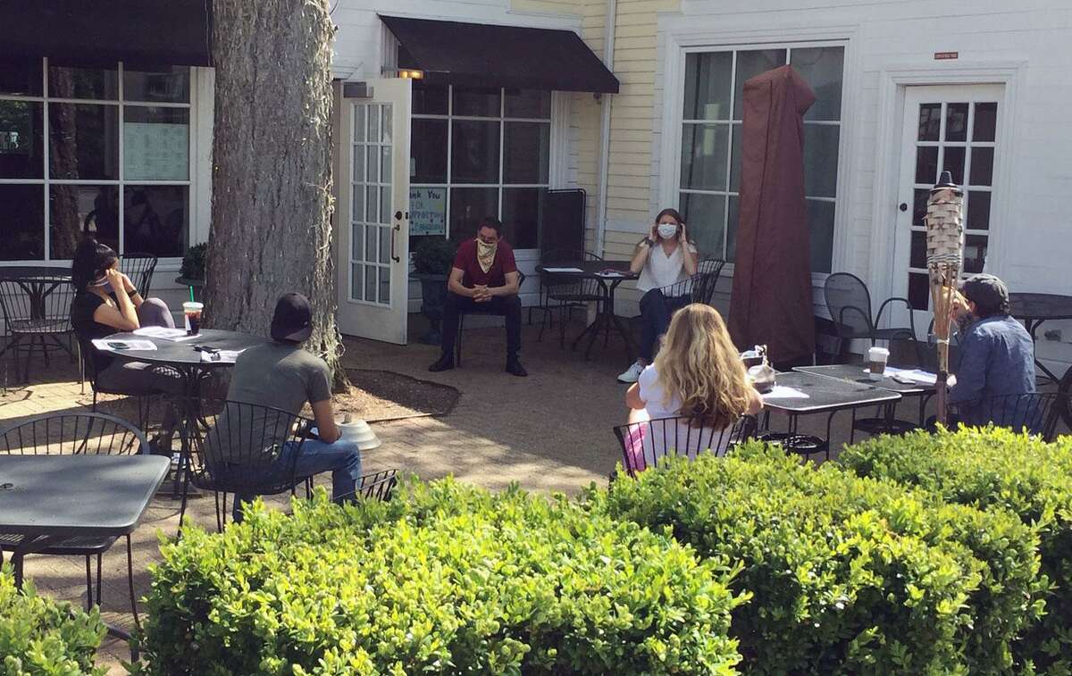 Staff at Marly's restaurant in Wilton Center discuss reopening plans.