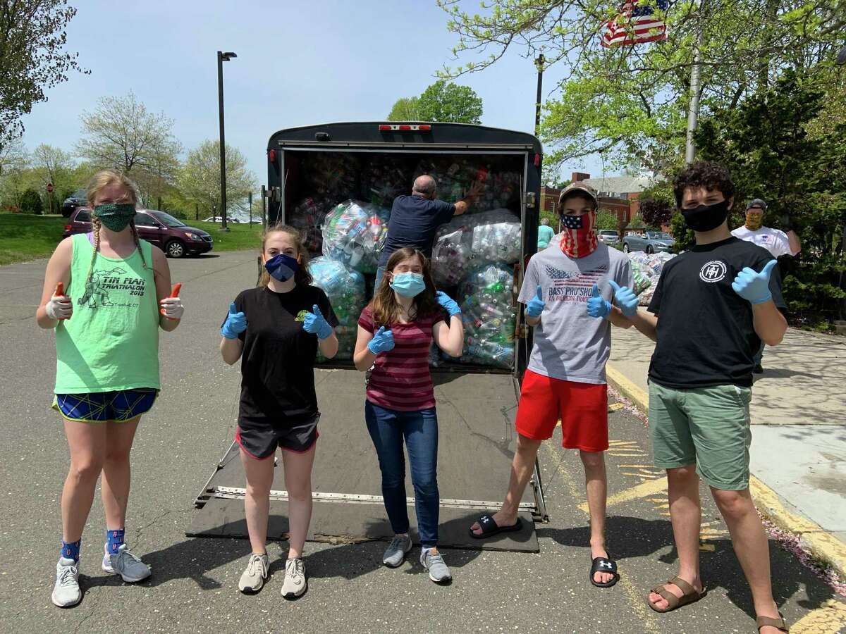 The Trumbull High School Golden Eagle Marching Band (THSGEMB) hosted a redeemables drive at the Trumbull Library on May 16. Students pictured are: Caitlyn Arnone, Brooke Formanek, Lizzie Steves, Aiden Giammarco, and Zachary Yorulmaz.