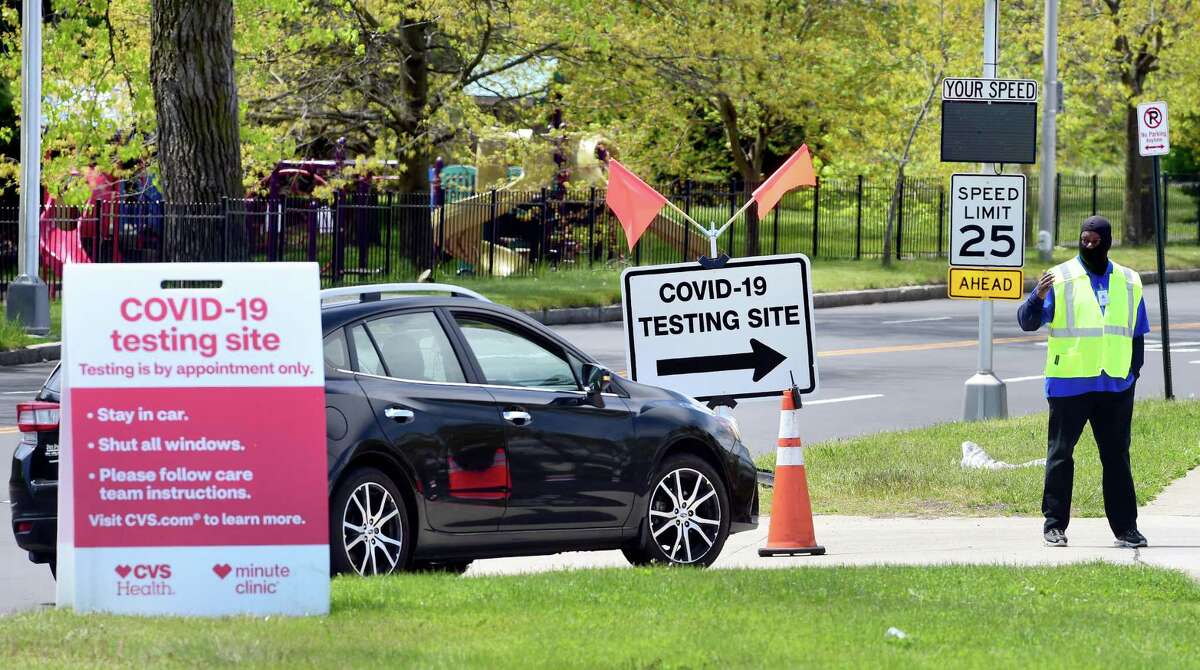 A car enters the rapid result drive-thru CVS Health COVID-19 test site on Sargent Drive in New Haven on May 14, 2020.