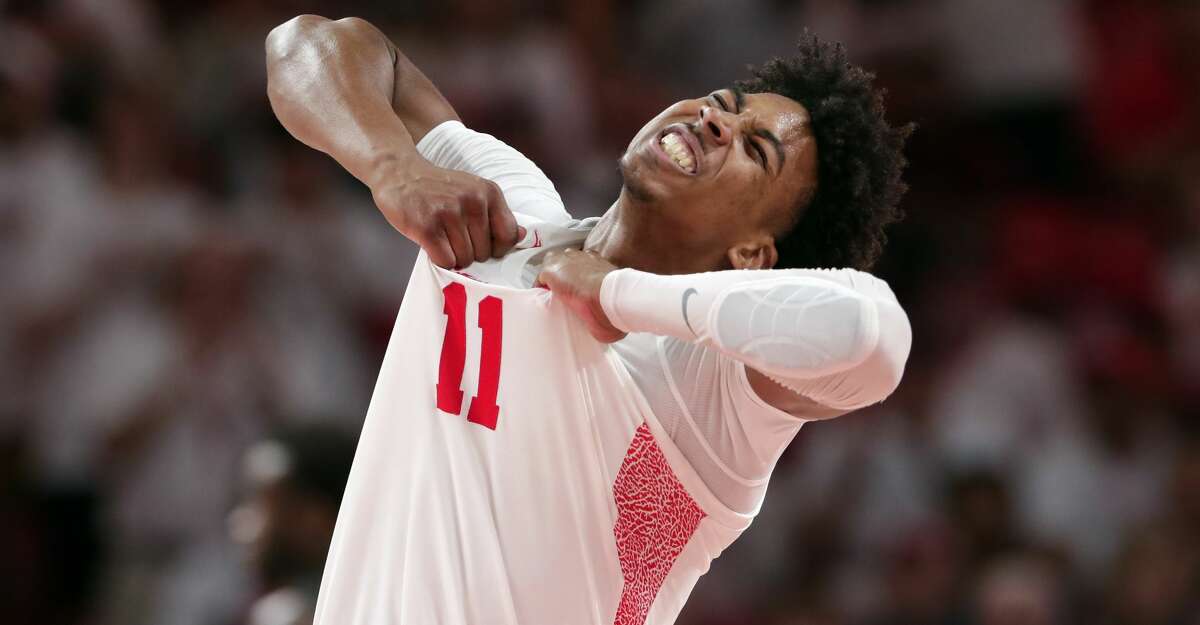 Houston guard Nate Hinton (11) celebrates a score against Cincinnati during the second half of an NCAA college basketball game Sunday, March 1, 2020, in Houston. (AP Photo/Michael Wyke)