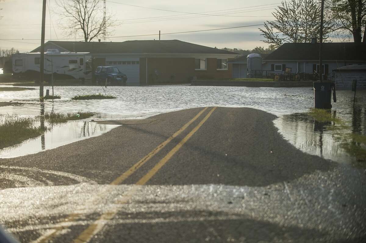 A neighborhood is flooded near Wixom Lake Tuesday, May 19, 2020 after an evacuation order the night before for residents of Sanford and Wixom Lakes, warning of "imminent dam failure." (Katy Kildee/kkildee@mdn.net)