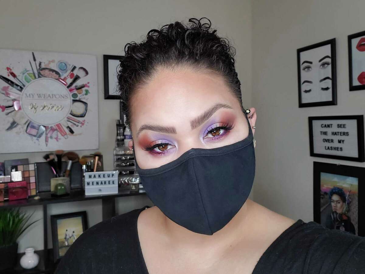 Melina Basnight, who makes makeup tutorials for her YouTube channel Makeup Menaree, shows off a bold eyeshadow look to go with her face mask.