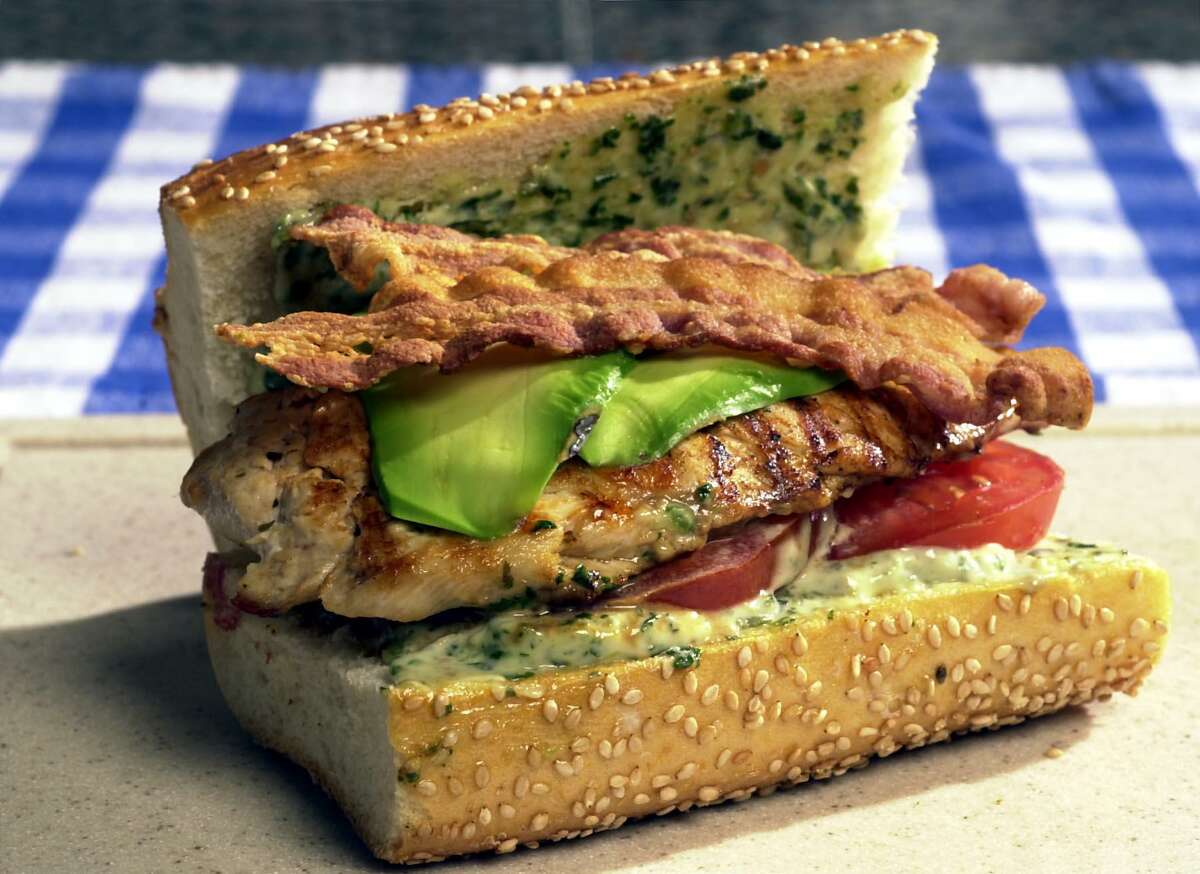 Pounded chicken breast makes a great grilled chicken sandwich with bacon, tomato, avocado and pesto mayo.