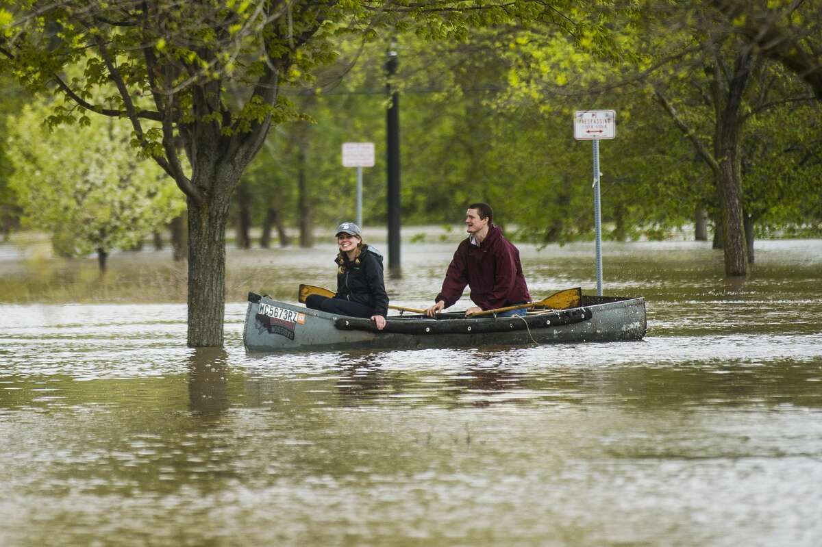 Midland residents head downtown to get a glimpse of the flood level Tuesday, May 19, 2020. The Tittabawassee River is expected to crest at 30.6 feet Wednesday morning. (Katy Kildee/kkildee@mdn.net)
