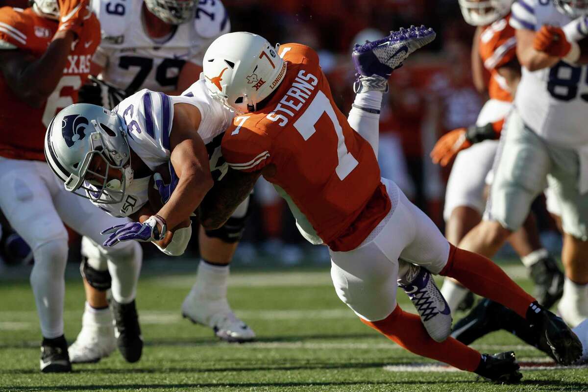 AUSTIN, TX - NOVEMBER 09: Tyler Burns #33 of the Kansas State Wildcats is tackled by Caden Sterns #7 of the Texas Longhorns in the first half at Darrell K Royal-Texas Memorial Stadium on November 9, 2019 in Austin, Texas. (Photo by Tim Warner/Getty Images)