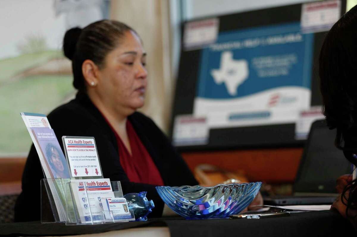 ACA Health Experts call center expert, Cynthia Hernandez helps Tiffany Wright get health insurance at the Ahmed and Roshan Virani Children's Clinic, Monday,Nov. 14, 2016 in Houston. It’s likely that 2021 health insurance premiums will remain around the same prices as 2020, experts said.