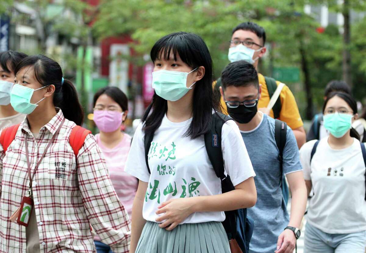 Face mask use is virtually universal in Taiwan, one of the countries least impacted by COVID-19 due to interventions. (Shown: Taipei street on May 18, 2020.)