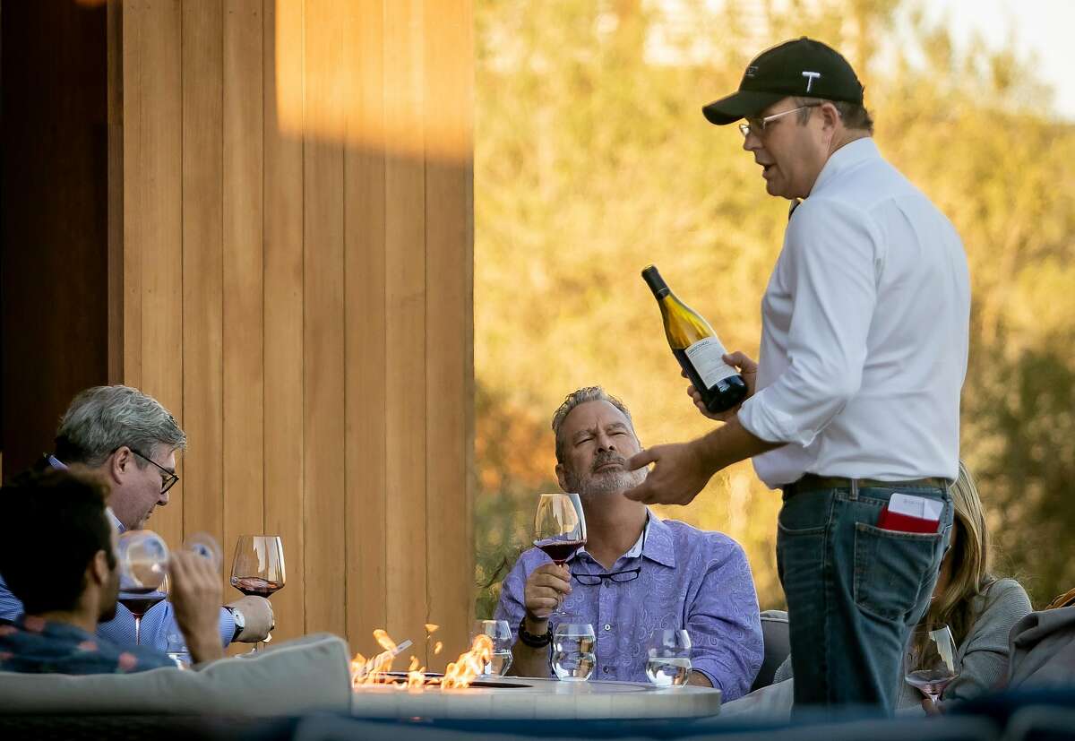 Brian Alllard pours wine for customers at the Bouchaine Winery tasting room in Napa, Calif. on November 9th, 2019.