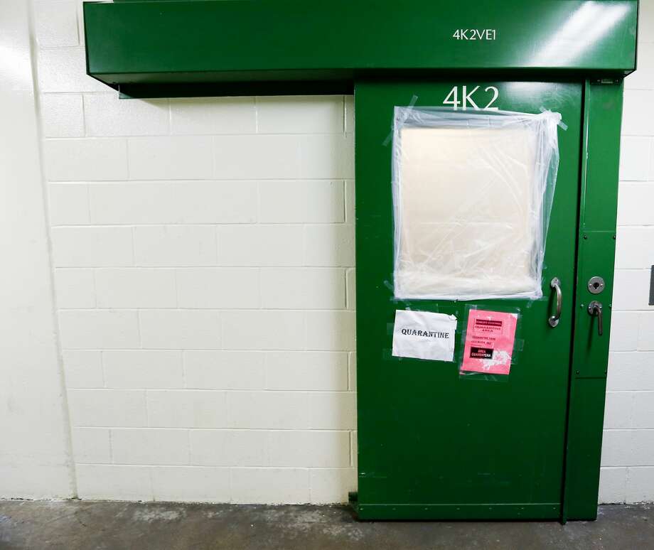 Signs posted outside a "hot" tank where all inmates had tested positive and were suffering from symptoms in solo cells. Photo: Elizabeth Conley/Staff Photographer / ? 2020 Houston Chronicle