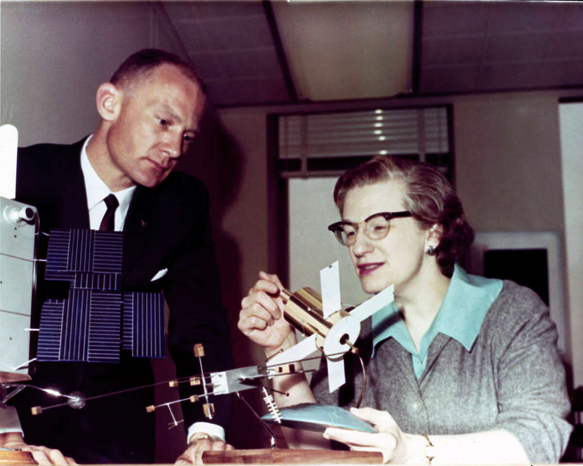 Nancy Grace Roman, NASA's first chief astronomer, explains the Advanced Orbiting Solar Observatory to astronaut Buzz Aldrin in 1965.