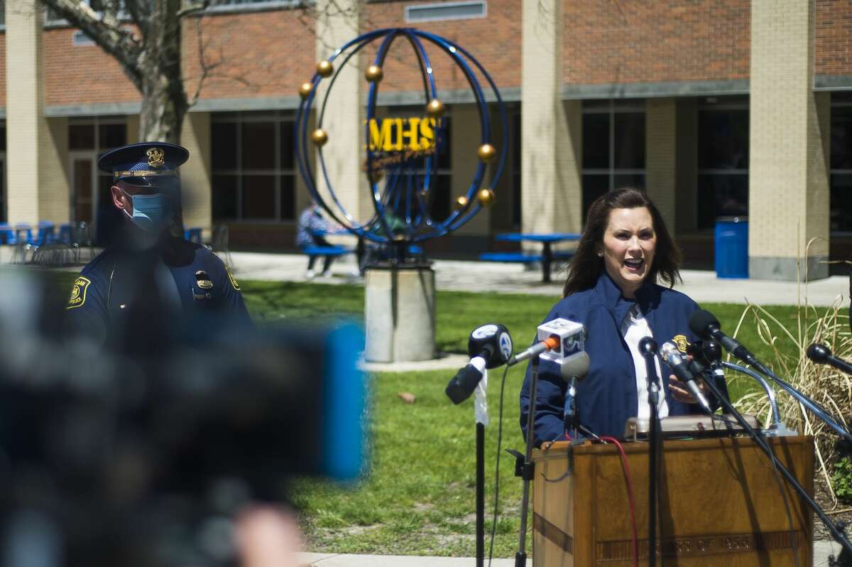 Gov. Gretchen Whitmer addresses members of the media and Midland County residents during a press conference at the temporary shelter at Midland High School Wednesday, May 20, 2020. Whitmer spoke of response efforts to severe flooding caused by dam failures upstream of the Tittabawassee River. (Katy Kildee/kkildee@mdn.net)