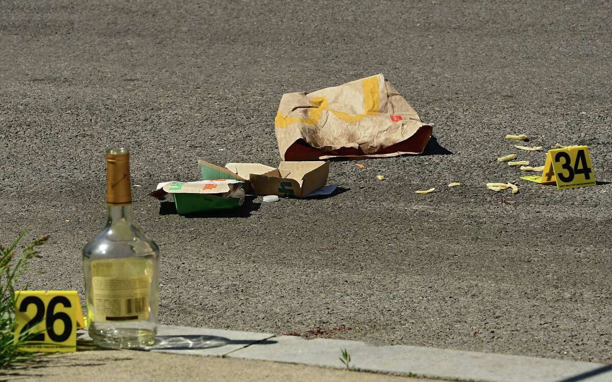 Evidence markers are placed next to objects at a scene where Fred Gentry, 48, died in a late-night shooting Tuesday on Victory Avenue on Wednesday, May 20, 2020 in Schenectady, N.Y. (Lori Van Buren/Times Union)