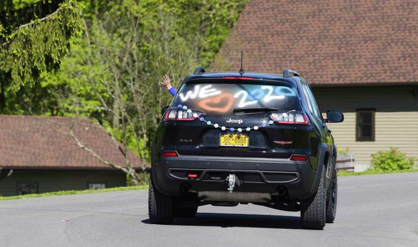 East Greenbush School District teachers and staff take part in a parade on Wednesday, May 20, 2020, in East Schodack, N.Y. Bus drivers, teachers and staff were visiting every senior from Columbia High School over two days. This year 300 students will graduate from Columbia. (Paul Buckowski/Times Union)