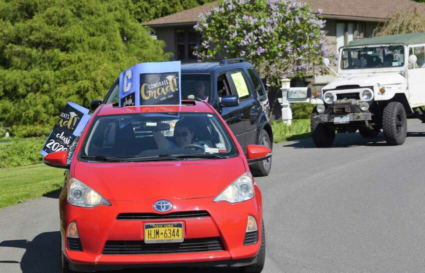 East Greenbush School District teachers and staff take part in a parade on Wednesday, May 20, 2020, in East Schodack, N.Y. Bus drivers, teachers and staff were visiting every senior from Columbia High School over two days. This year 300 students will graduate from Columbia. (Paul Buckowski/Times Union)